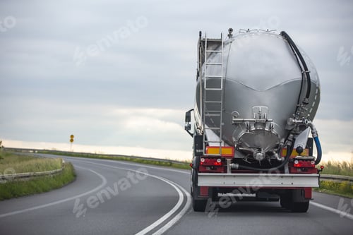 Preview: Long vehicle truck with tank trailer on a highway.