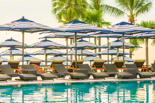 Preview: Umbrella and chair sofa around outdoor swimming pool in hotel re