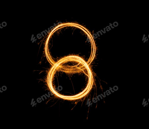 Preview: Fireworks numbers 8 Burning sparkler Numbers isolated on black background. Sparkler firework light