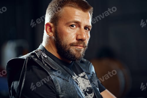 Preview: Portrait of motorbike rider in black leather outfit