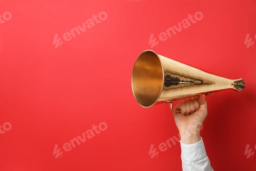 Preview: Woman holding retro megaphone on color background