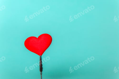Preview: A red heart on a blue background on a stand