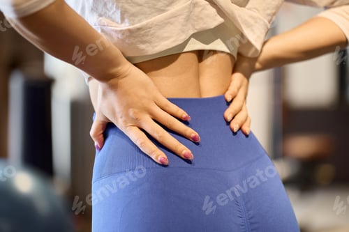 Preview: Woman hurting her back at the gym
