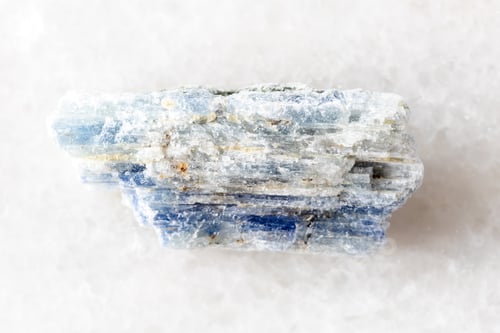 Preview: sample of uncut kyanite rock on white marble