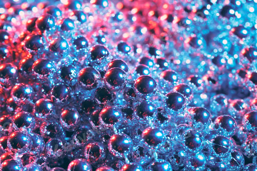 Preview: Party or holiday decoration concept - close up of silver shiny beads
