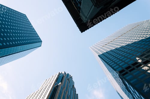 Preview: Low angle view of skyscrapers against blue sky in Nerw York