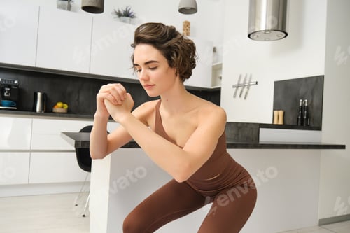 Preview: Workout and women wellbeing concept. Young fitness woman, doing squats, workout from home without