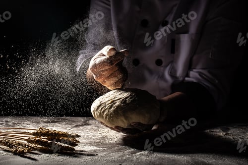 Preview: Making dough by hands at bakery or at home. Flour cloud in the air