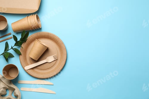 Preview: Composition with eco - friendly tableware and plant on blue background, space for text