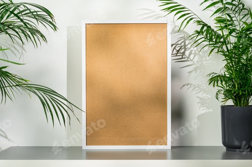 Preview: White wooden photo frame with plant leaves on white background