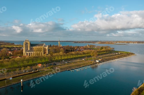 Preview: High angle shot of a beautiful river surrounded by buildings in Veere, The Netherlands