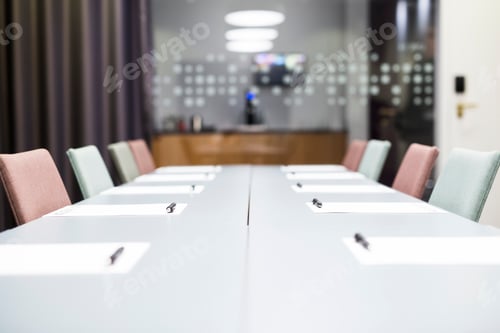 Preview: Papers and pen on conference table in office