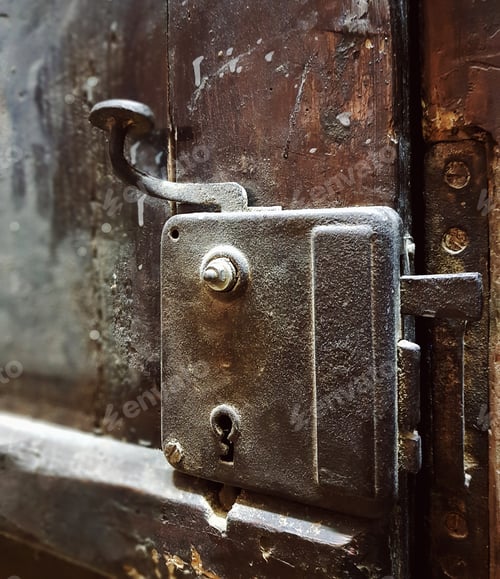 Preview: Dusty old door handle and lock on old wooden door.
