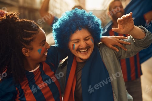 Preview: Cheerful soccer fans having fun on the street while going on a match during world championship.