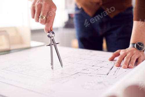 Preview: Close Up Of Male Architect In Office Measuring Plan Or Blueprint Using Dividers