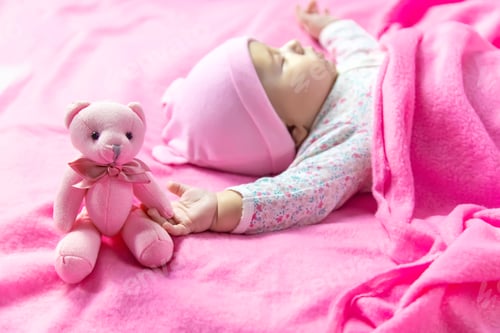 Preview: Baby sleeps with a bear. Selective focus.