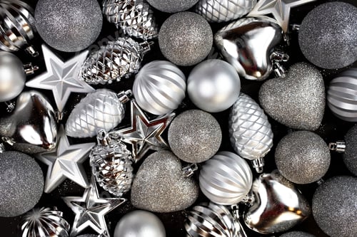Preview: Christmas composition. Lots of silver Christmas tree decorations, top view.