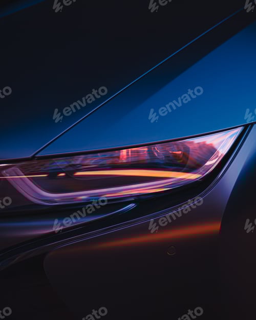 Preview: Car headlight, buildings reflecting in the headlight of a car