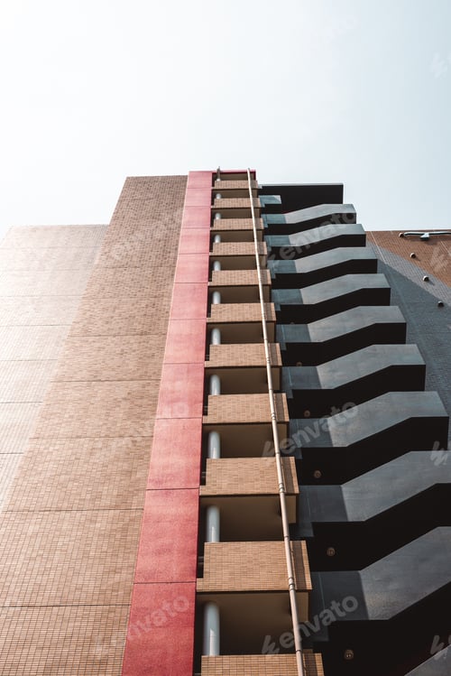 Preview: Modern building facade with geometric patterns and contrasting colors.