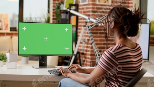 Preview: African american freelancer working from home with greenscreen