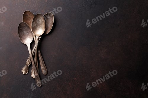 Preview: Old vintage spoons on stone table