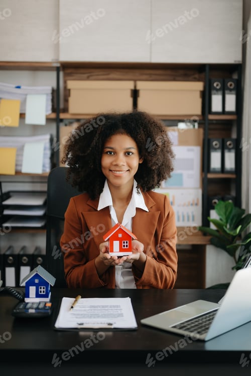 Preview: Young real estate agent worker working with laptop and tablet at table in office and small