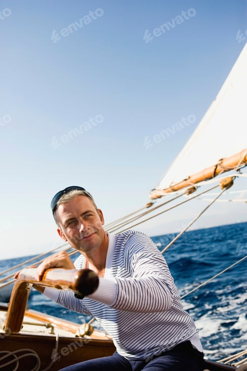 Preview: man steering a sailing boat