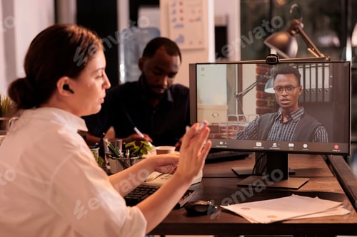Preview: Colleagues having conversation on corporate online meeting on computer