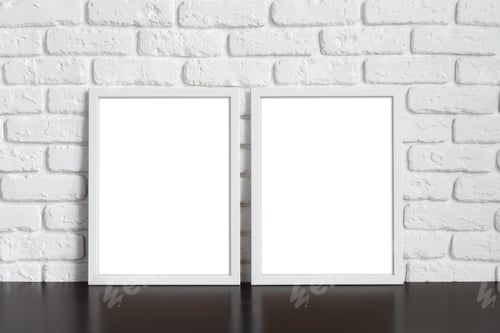 Preview: Blank picture frame against brick wall with copy space