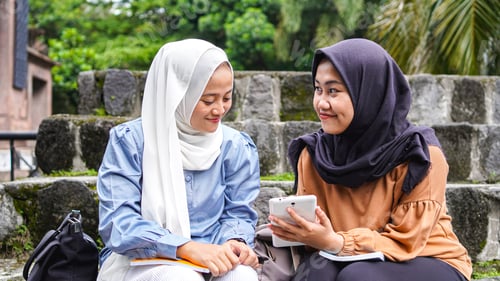 Preview: two Asian woman student friends discussing
