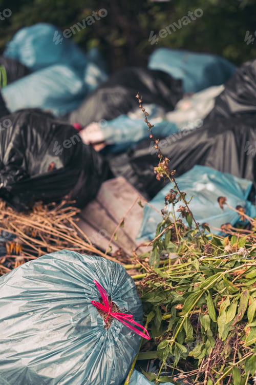 Preview: Closeup shot of a pile of trash bags - pollution concept