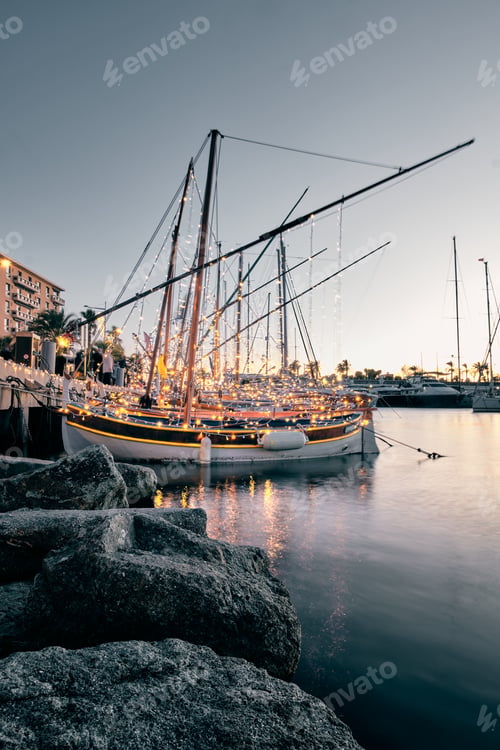 Preview: Vertical shot of illuminated sailboats at the port of Saint Raphael, Cote d'Azur - France