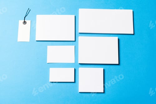 Preview: blank office objects organized for company presentation on blue paper background