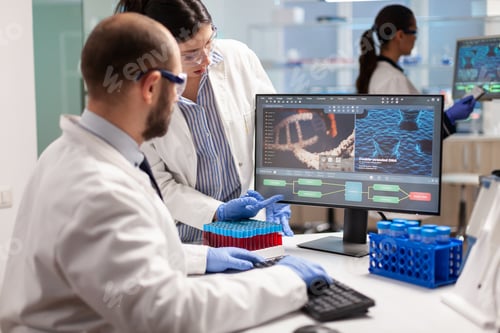 Preview: Group of scientists working in modern equipped laboratory