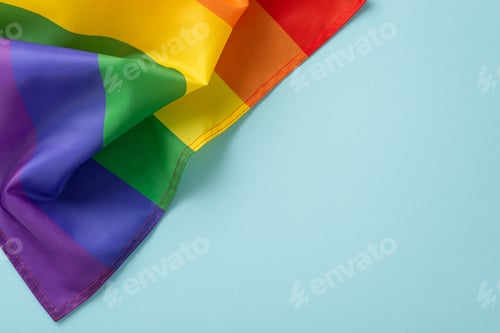 Preview: Celebrating LGBT History Month with a flat lay top view of rainbow-themed parade flag