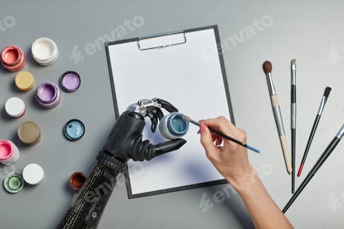 Preview: Woman with disability painting on paper
