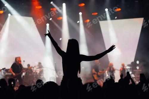 Preview: Fan enjoys live music concert with arms spread wide
