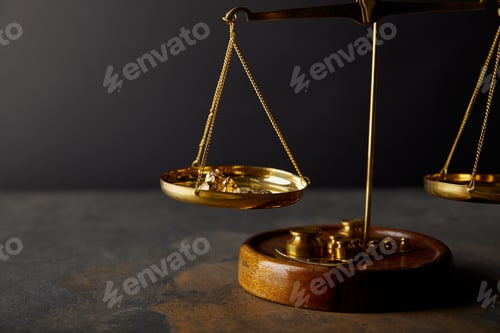 Preview: golden stones on scales on marble surface and black background