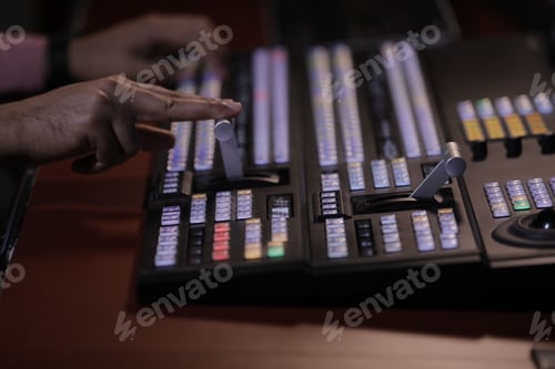 Vista previa: Close up hand on video switcher panel