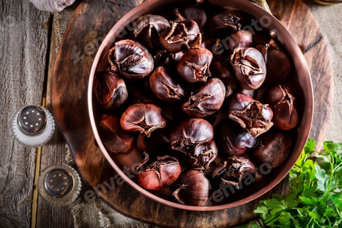 Preview: Closeup of roasted chestnuts with garlic sauce