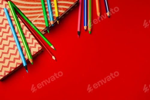 Preview: Notepad and color pencils on working space top view