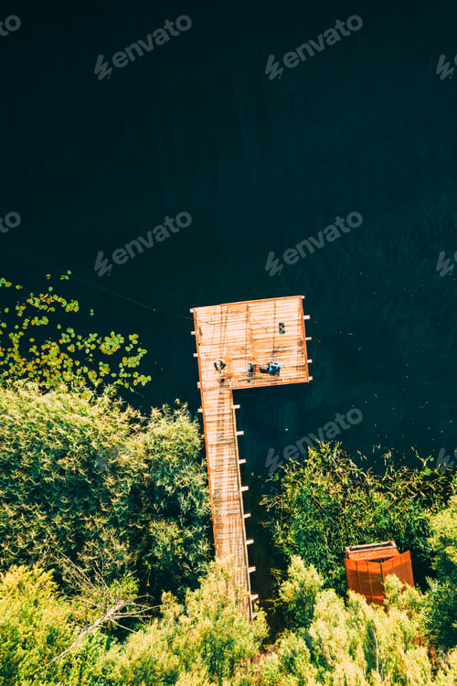 Preview: Aerial View Of Fishing Pier With River Lake Around. Top View Of River Coast With Forest In Summer
