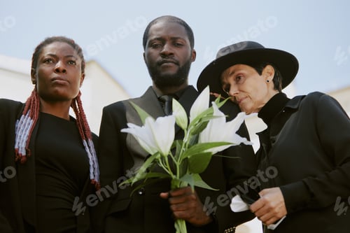 Preview: Biracial Family Crying at Cemetery