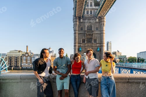 Preview: Multiracial group of happy young friends bonding in London