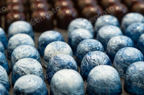 Preview: Exclusive handmade chocolate candy covered with blue glaze