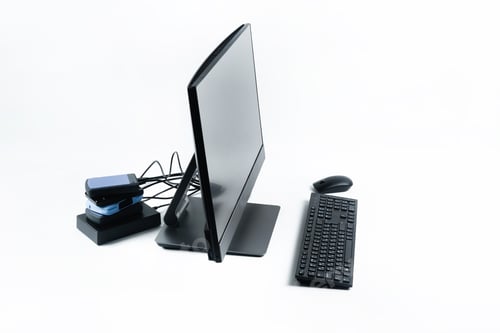 Preview: Multiple external hard drives connected to a monoblock on a white background.Computer with hard