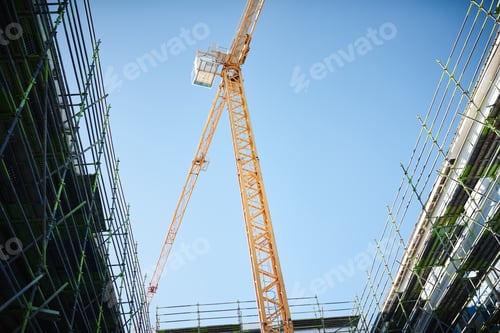 Preview: The city is rising up. Shot of a crane and building at a construction site.