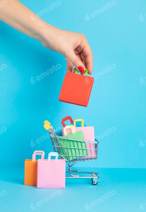 Preview: Shopping basket full of paper bags. Sesonal sale, online deals, discounts, promotions idea