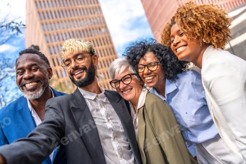 Preview: Multi-ethnic business people smiling and taking a selfie outdoors