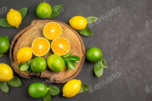 Preview: top view fresh sour lemons on the dark background lime tree citrus fruit